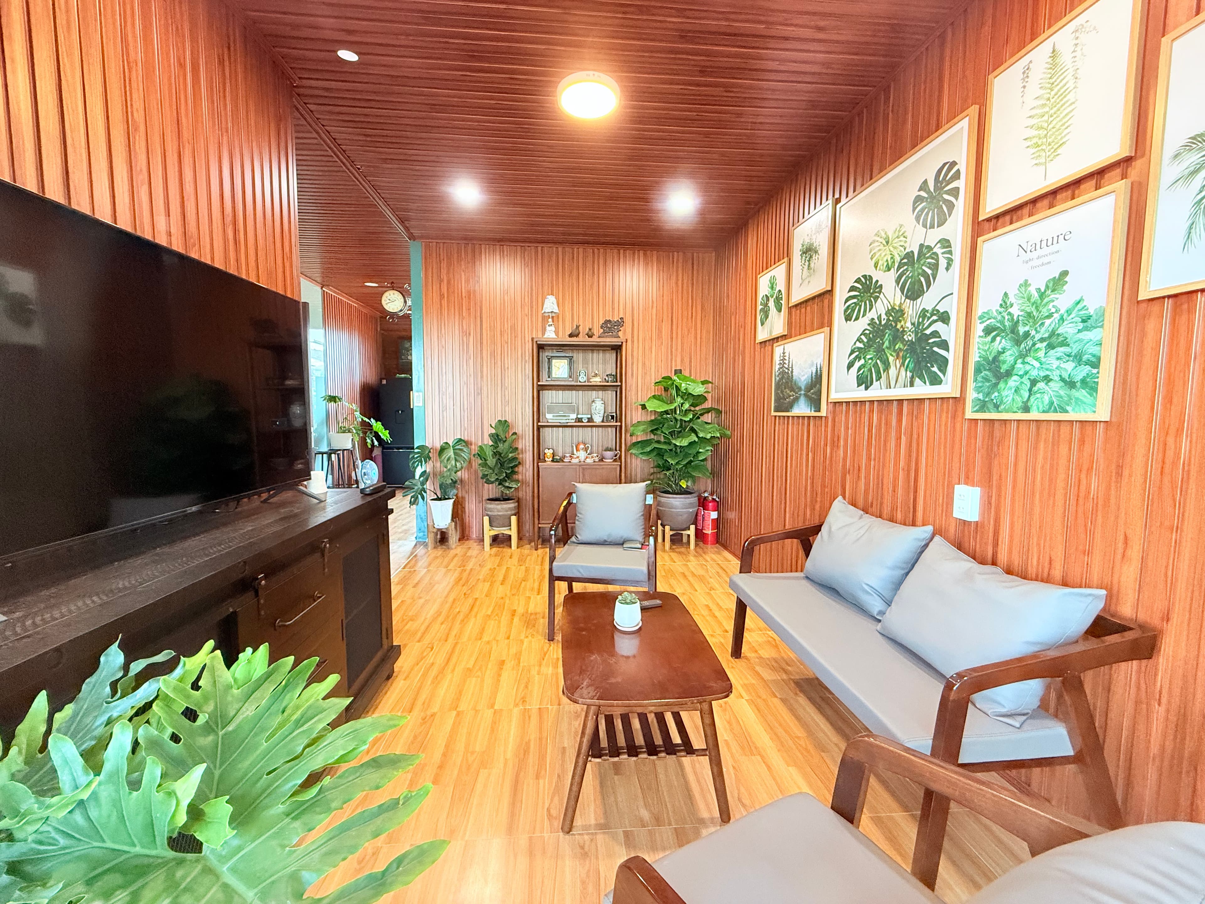 Warm, wood-paneled living rooms